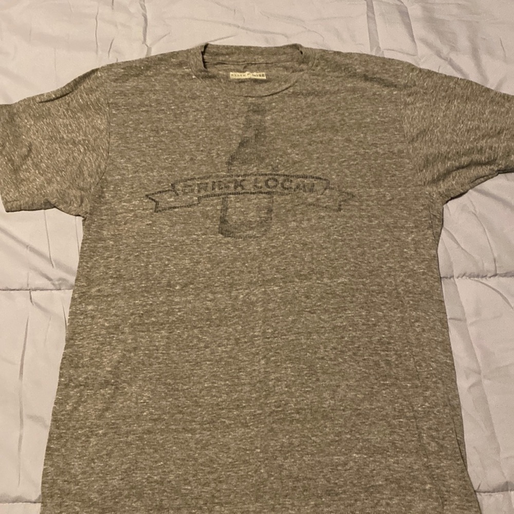 Gray men’s small T-shirt. Says “drink local”